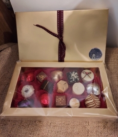 A Christmas gold box of assorted chocolates